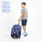 Child pulling a blue suitcase with star pattern on a white background