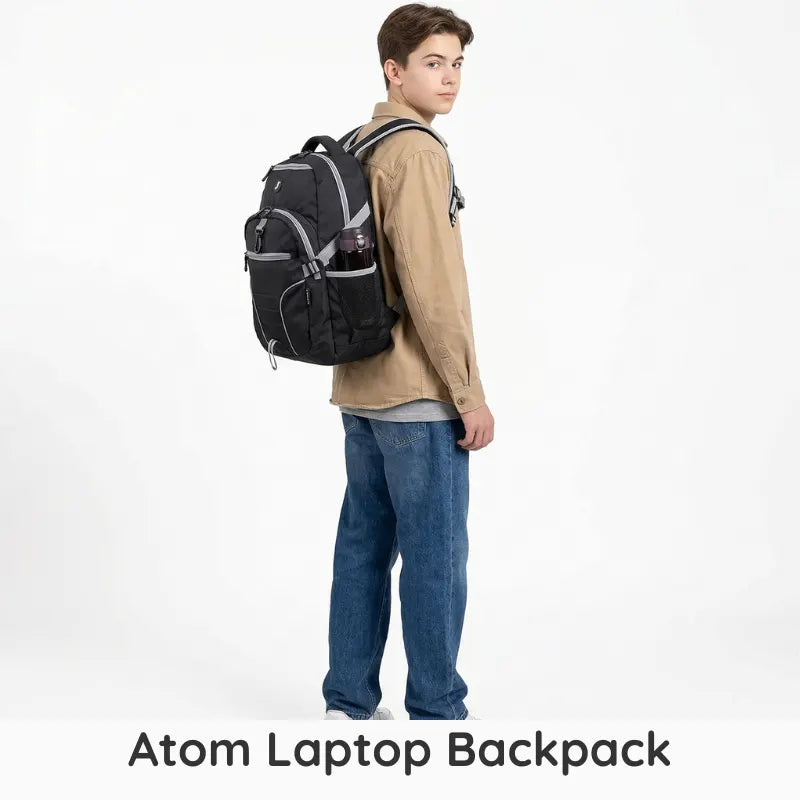Person wearing a black Atom Laptop Backpack on a white background